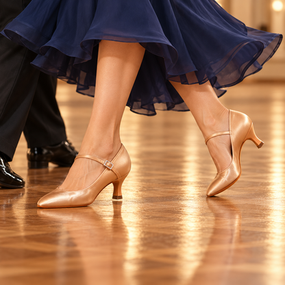 Grace 183 tan satin ballroom shoes worn during a ballroom dance with a navy skirt